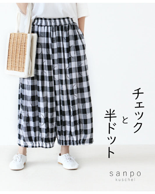 Check and half-polka dot pants