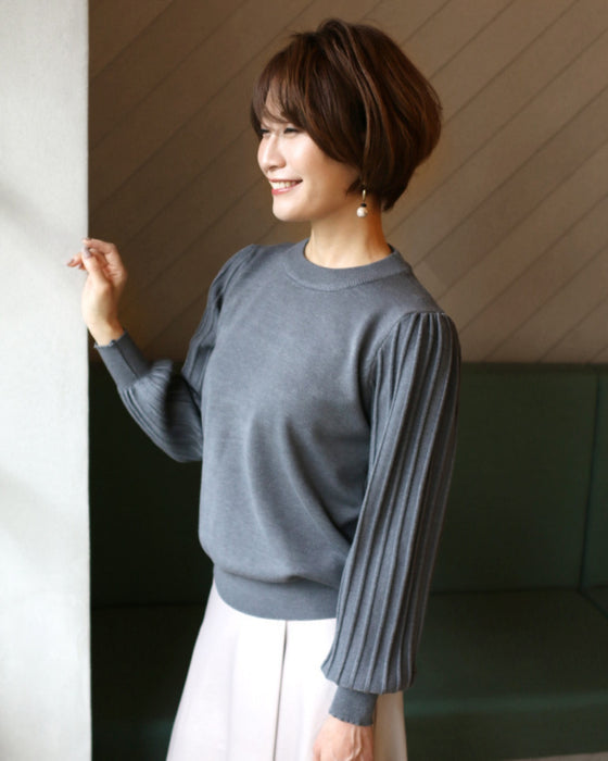 A simple knit with a unique sleeve design that's sure to become a staple in your wardrobe!