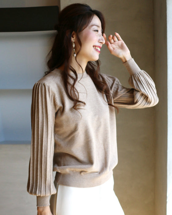 A simple knit with a unique sleeve design that's sure to become a staple in your wardrobe!