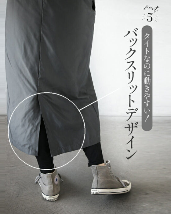 A shiny jumper skirt with a fashionable two-tone design