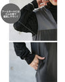 A shiny jumper skirt with a fashionable two-tone design