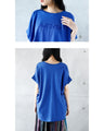 A logo T-shirt with sharp horn sleeves and tucked hem for a sophisticated look