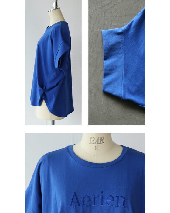 A logo T-shirt with sharp horn sleeves and tucked hem for a sophisticated look