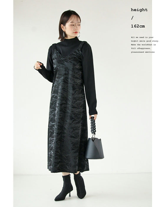 A faux leather jumper skirt with a texture that will charm adults
