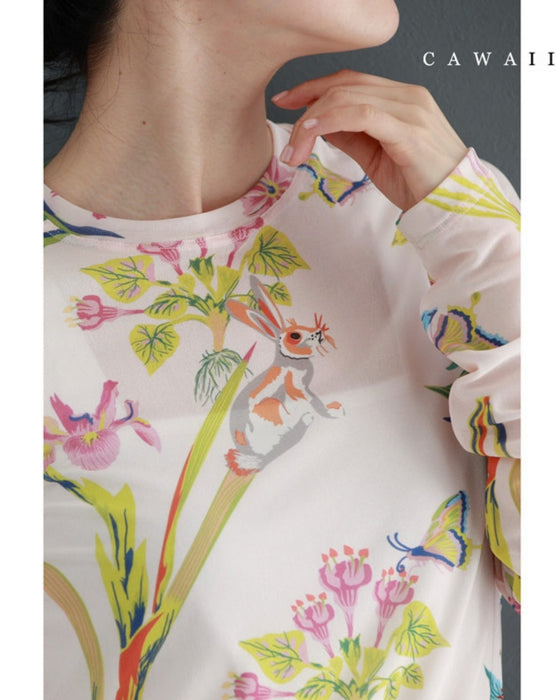 Sheer cut-and-sew top featuring animals and plants living in paradise