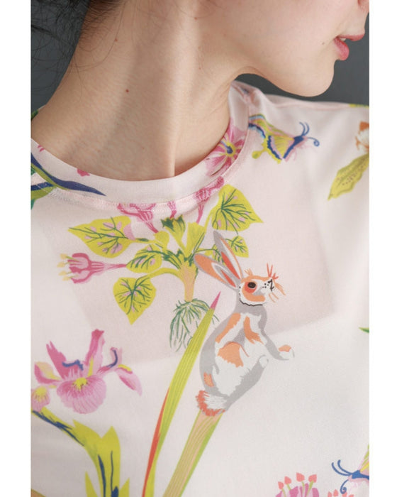 Sheer cut-and-sew top featuring animals and plants living in paradise
