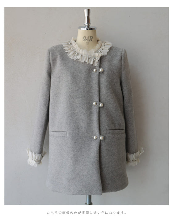 A pearl button coat with sparkling beaded daisy frills