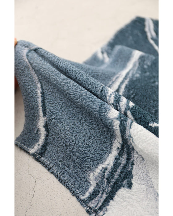 流動的なアート柄の伸びやかドルマンカットソートップス