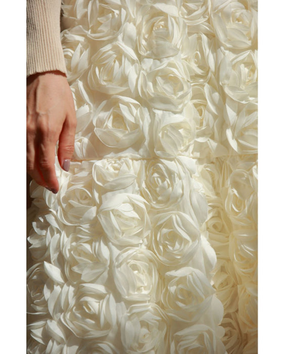 A voluminous bouquet skirt wrapped in rose flowers