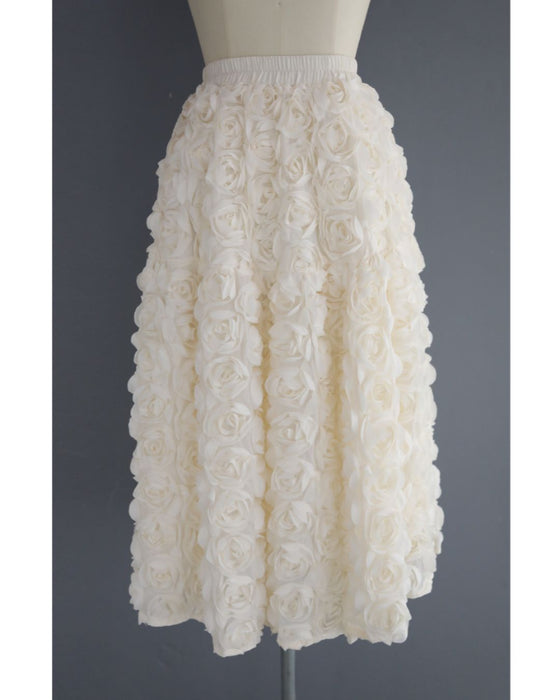 A voluminous bouquet skirt wrapped in rose flowers