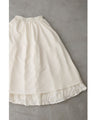 A voluminous bouquet skirt wrapped in rose flowers