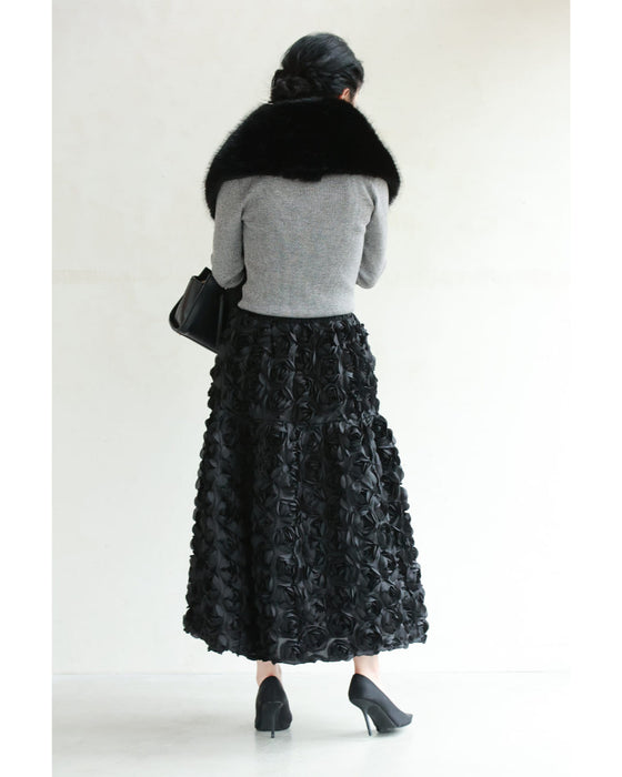 A voluminous bouquet skirt wrapped in rose flowers