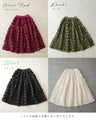 A voluminous bouquet skirt wrapped in rose flowers