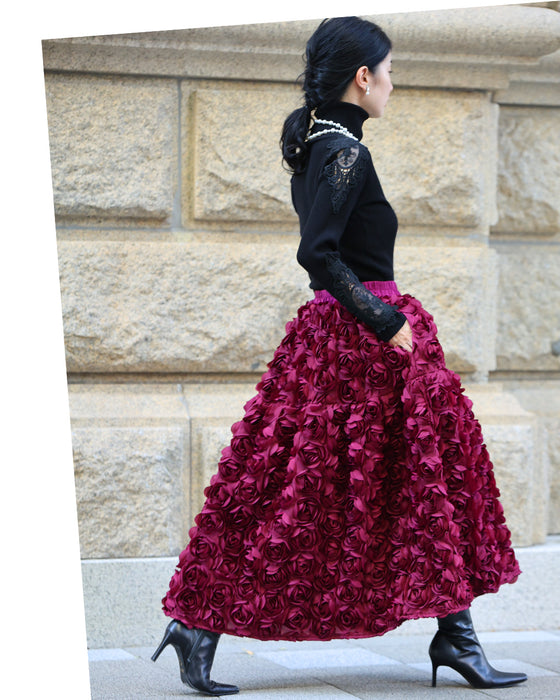 A voluminous bouquet skirt wrapped in rose flowers