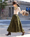 A voluminous bouquet skirt wrapped in rose flowers
