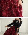 A voluminous bouquet skirt wrapped in rose flowers