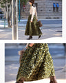 A voluminous bouquet skirt wrapped in rose flowers