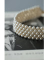 A luxurious, shiny piece for your neck. Wide pearl choker