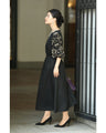 Black tuck dress with floral lace sleeves (black)