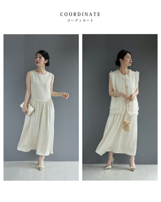 A dress with a tweed-like top and a glossy skirt, sparkling with sequins