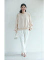 A sweatshirt top with bubble pearls that bubble up like bubbles