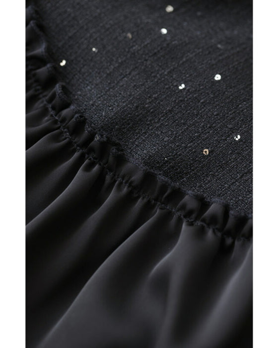 A dress with a tweed-like top and a glossy skirt, sparkling with sequins