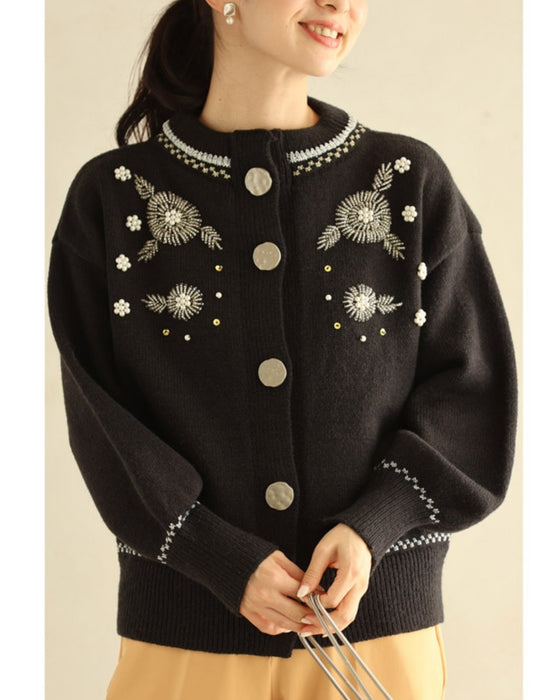 Knitted cardigan with flowers drawn with beads and jewels