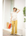 Asymmetrical draped tuck cut and sew top