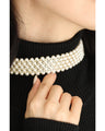 A luxurious, shiny piece for your neck. Wide pearl choker