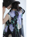 A sheer floral mini dress with a translucent feel