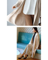 A long knit cardigan that can be worn as a coat for the changing seasons