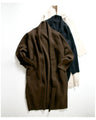 A long knit cardigan that can be worn as a coat for the changing seasons