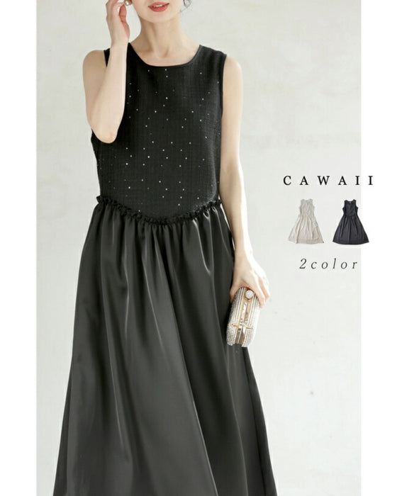 A dress with a tweed-like top and a glossy skirt, sparkling with sequins