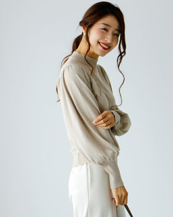 A feminine, evolved version of the turtleneck knit