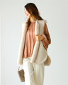 Brighten up your outfit! A reversible fur vest that will help you transition from autumn to winter