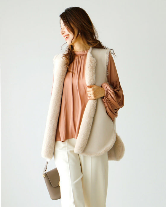 Brighten up your outfit! A reversible fur vest that will help you transition from autumn to winter