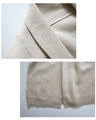 A long knit cardigan that can be worn as a coat for the changing seasons