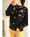 Knitted cardigan with flowers drawn with beads and jewels