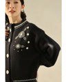 Knitted cardigan with flowers drawn with beads and jewels