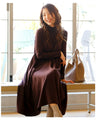 A loose, slender-looking long knit dress