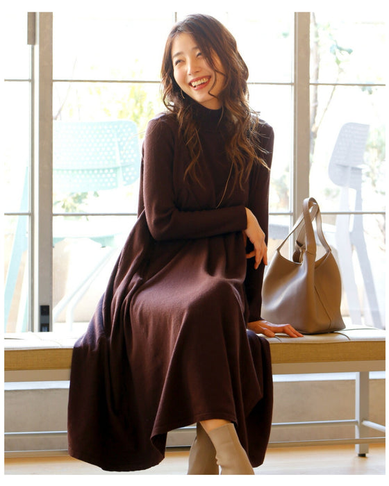 A loose, slender-looking long knit dress