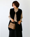 Brighten up your outfit! A reversible fur vest that will help you transition from autumn to winter