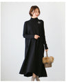 A loose, slender-looking long knit dress