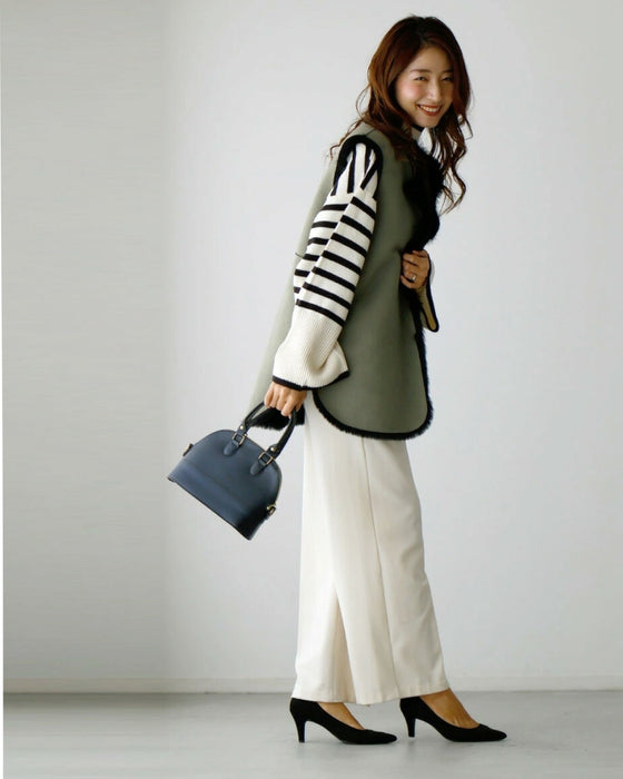 Brighten up your outfit! A reversible fur vest that will help you transition from autumn to winter