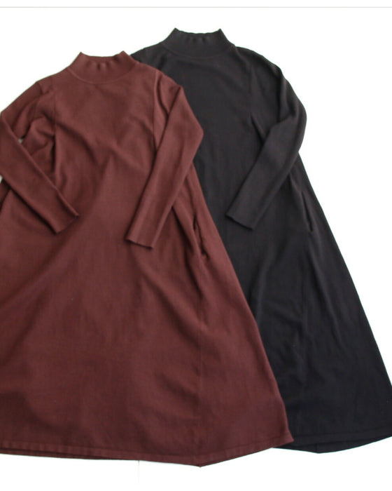 A loose, slender-looking long knit dress