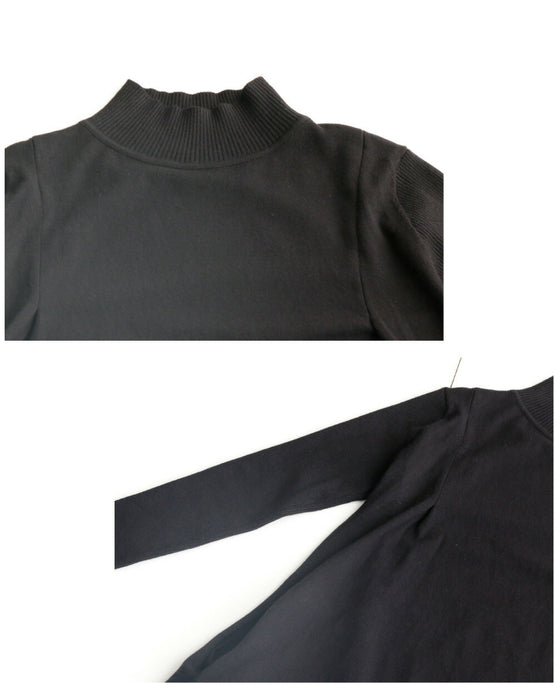 A loose, slender-looking long knit dress