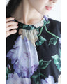 A sheer floral mini dress with a translucent feel