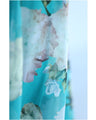 A sheer floral mini dress with a translucent feel