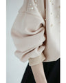 A sweatshirt top with bubble pearls that bubble up like bubbles