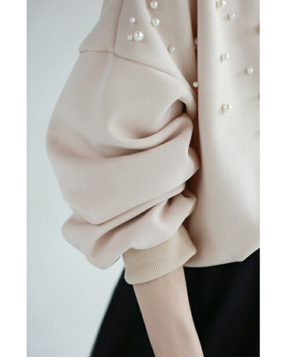 A sweatshirt top with bubble pearls that bubble up like bubbles